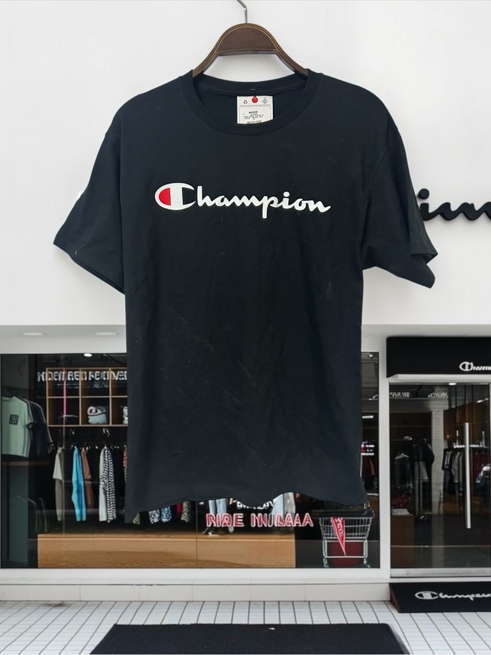 Champion Black Short Sleeve Tee with White Script Logo and Red Accent